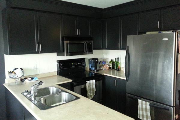 Kitchen cabinets painted with a fresh black paint