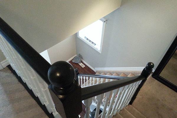 Stairs with white spindles and black stained tops