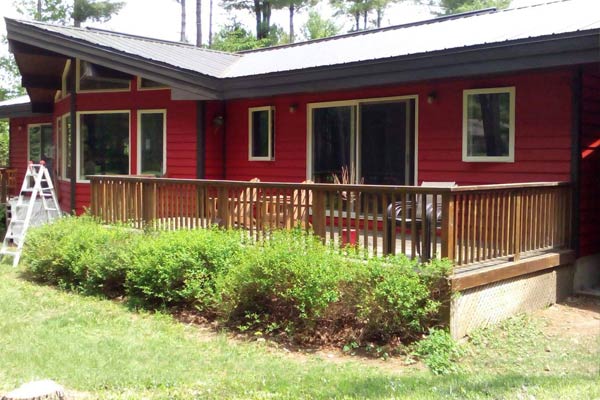 Cottage painted in red walls and white windows trims