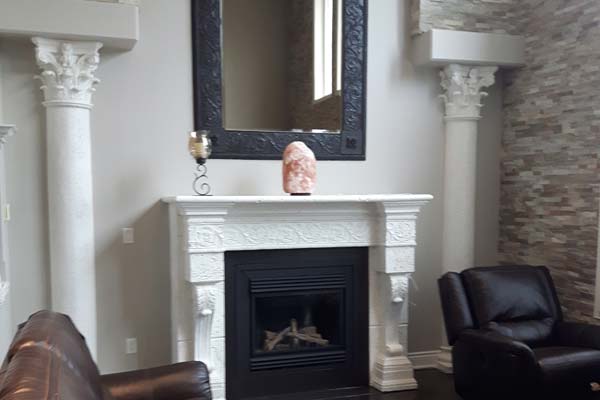 White painted columns and fireplace