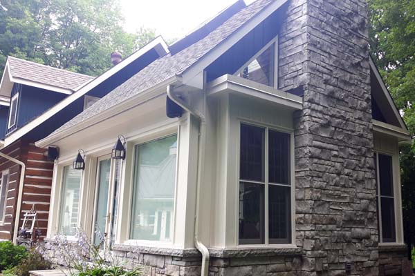 Outside of  house painted in white and blue contrasting colours