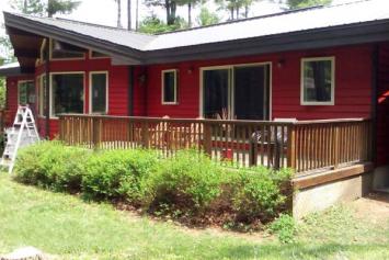 Cottage painted in red walls and white windows trims