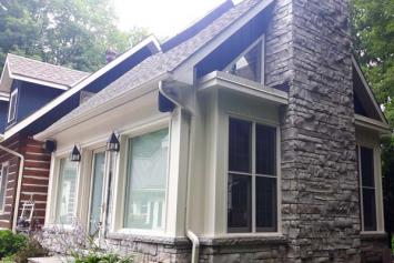 Outside of  house painted in white and blue contrasting colours